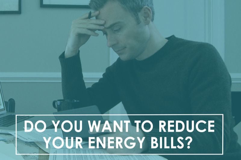 Video - Do You Want to Reduce Your Energy Bills? Image shows man reviewing energy bill while sitting at table with his arm resting on the table.